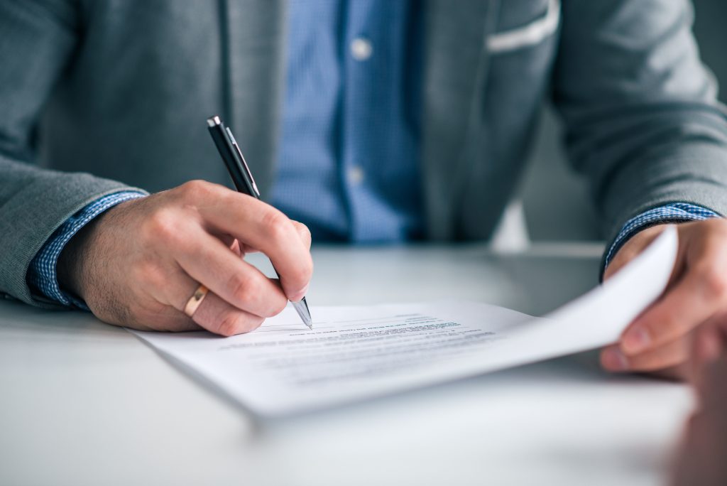 IFA adviser reviewing compliance documentation and preparing for business sale.